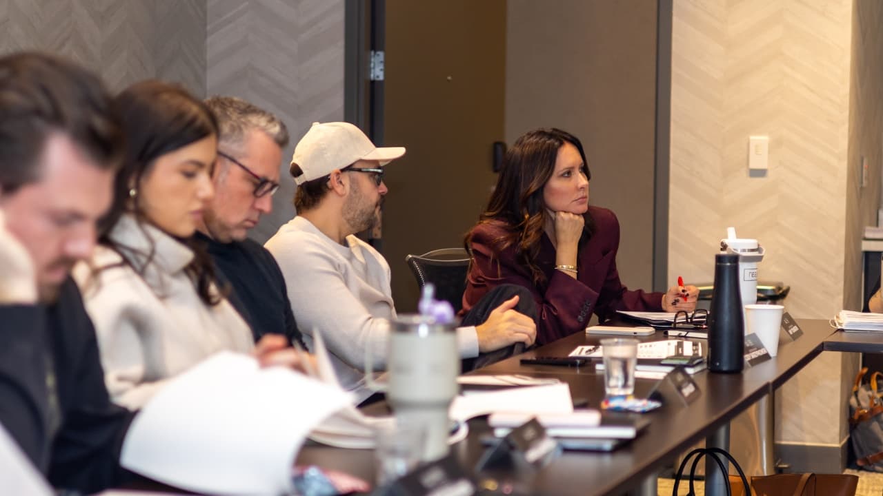 Amy listening intently at a leadership roundtable